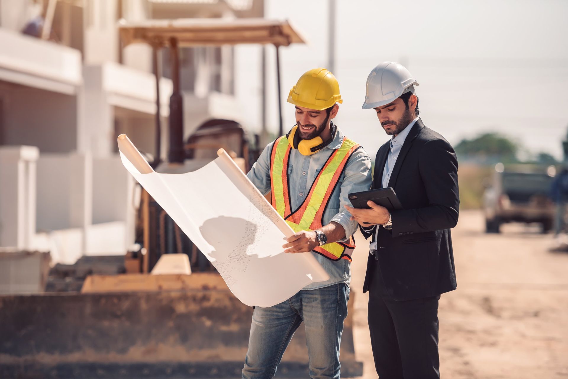 DEED-IN engineers reviewing drawings on site
